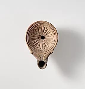 Terracotta oil lamp by Unknown Artist