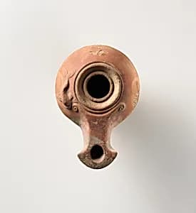 Terracotta oil lamp by Unknown Artist