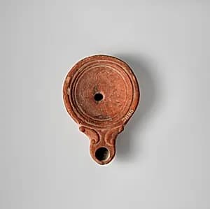 Terracotta oil lamp by Unknown Artist