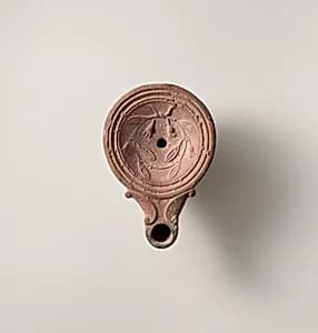 Terracotta oil lamp by Unknown Artist