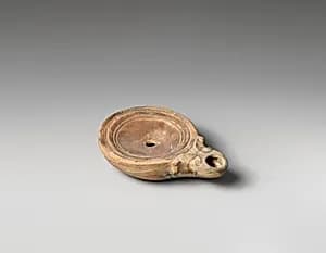 Terracotta oil lamp by Unknown Artist