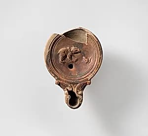 Terracotta oil lamp by Unknown Artist