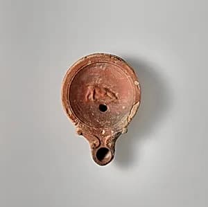 Terracotta oil lamp by Unknown Artist