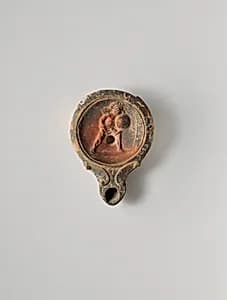 Terracotta oil lamp by Unknown Artist