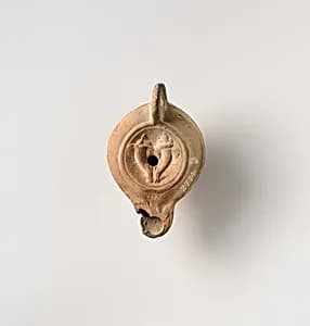 Terracotta oil lamp by Unknown Artist