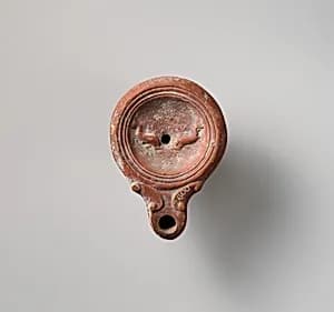 Terracotta oil lamp by Unknown Artist