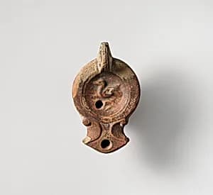 Terracotta oil lamp by Unknown Artist