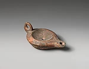 Terracotta oil lamp by Unknown Artist