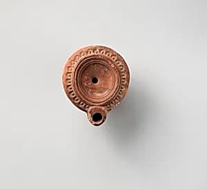 Terracotta oil lamp by Unknown Artist
