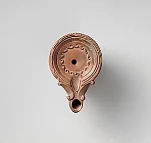 Terracotta oil lamp by Unknown Artist