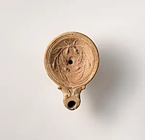 Terracotta oil lamp by Unknown Artist