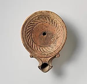 Terracotta oil lamp by Unknown Artist