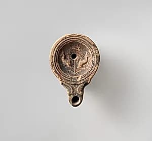 Terracotta oil lamp by Unknown Artist