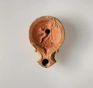 Terracotta oil lamp by Unknown Artist