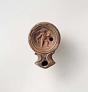 Terracotta oil lamp by Unknown Artist