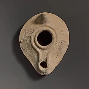 Terracotta oil lamp by Unknown Artist