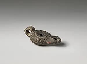 Terracotta oil lamp by Unknown Artist