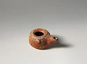 Terracotta oil lamp by Unknown Artist
