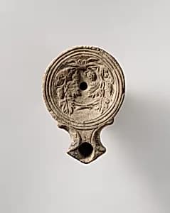 Terracotta oil lamp by Unknown Artist