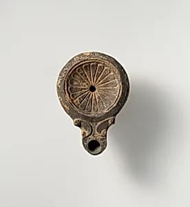 Terracotta oil lamp by Unknown Artist
