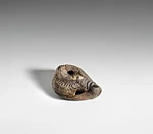 Terracotta oil lamp by Unknown Artist