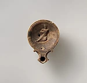 Terracotta oil lamp by Unknown Artist