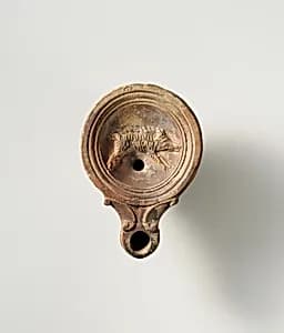 Terracotta oil lamp by Unknown Artist