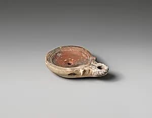 Terracotta oil lamp by Unknown Artist