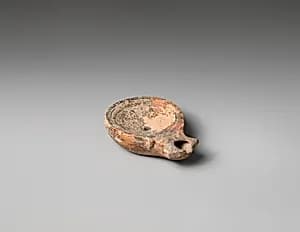 Terracotta oil lamp by Unknown Artist