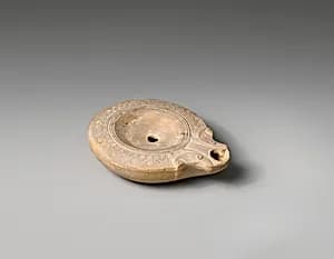 Terracotta oil lamp by Unknown Artist