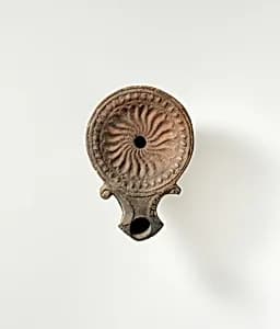 Terracotta oil lamp by Unknown Artist