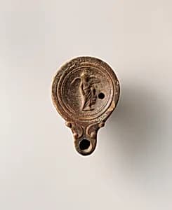 Terracotta oil lamp by Unknown Artist