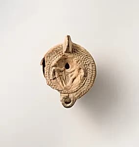 Terracotta oil lamp by Unknown Artist