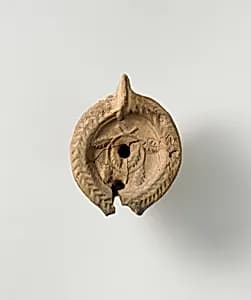 Terracotta oil lamp by Unknown Artist