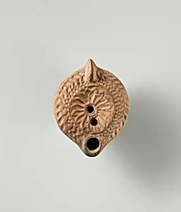 Terracotta oil lamp by Unknown Artist