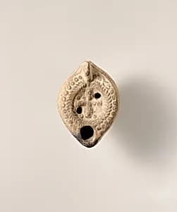 Terracotta oil lamp by Unknown Artist