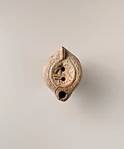 Terracotta oil lamp by Unknown Artist