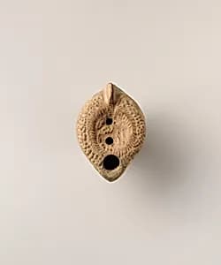 Terracotta oil lamp by Unknown Artist