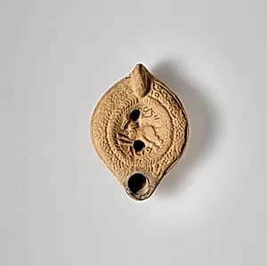 Terracotta oil lamp by Unknown Artist