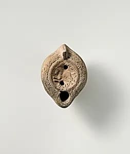 Terracotta oil lamp by Unknown Artist
