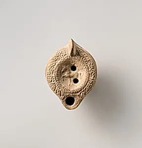 Terracotta oil lamp by Unknown Artist
