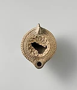 Terracotta oil lamp by Unknown Artist