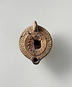 Terracotta oil lamp by Unknown Artist