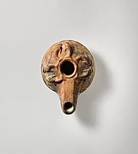 Terracotta oil lamp by Unknown Artist