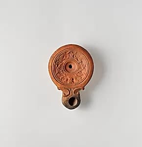 Terracotta oil lamp by Unknown Artist