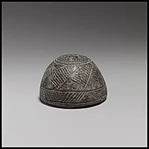 Terracotta spindle whorl by Unknown Artist