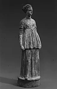 Terracotta statuette of a girl by Unknown Artist