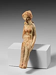 Terracotta statuette of a seated woman by Unknown Artist