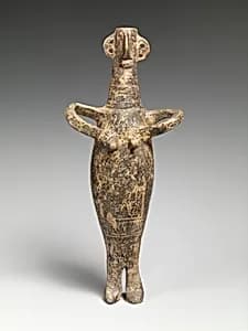 Terracotta statuette of a woman by Unknown Artist