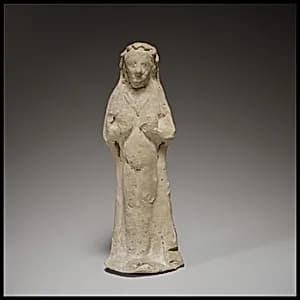 Terracotta statuette of a woman by Unknown Artist